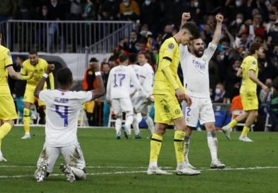Real Madrid players celebrate their while Chelsea players lick wound